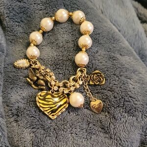 Elegant Gold and Cream Charm Bracelet